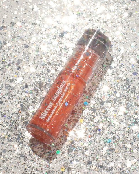 Сонцезахисний блиск для губ Mirror Sungloss Sparkling Bellini SPF 20+ PA++ Hugs 5,5 ml 0209 фото